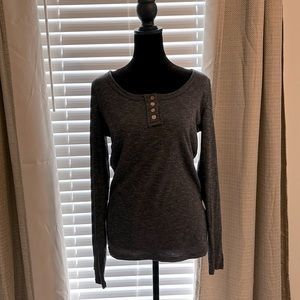 Long-sleeved shirt. Grey color. Size medium. Never worn.